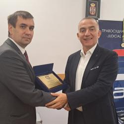 The Director of the Judicial Academy, Nenad Vujić, was presented with a plaque for many years of work on improving the judiciary of the Republic of Serbia